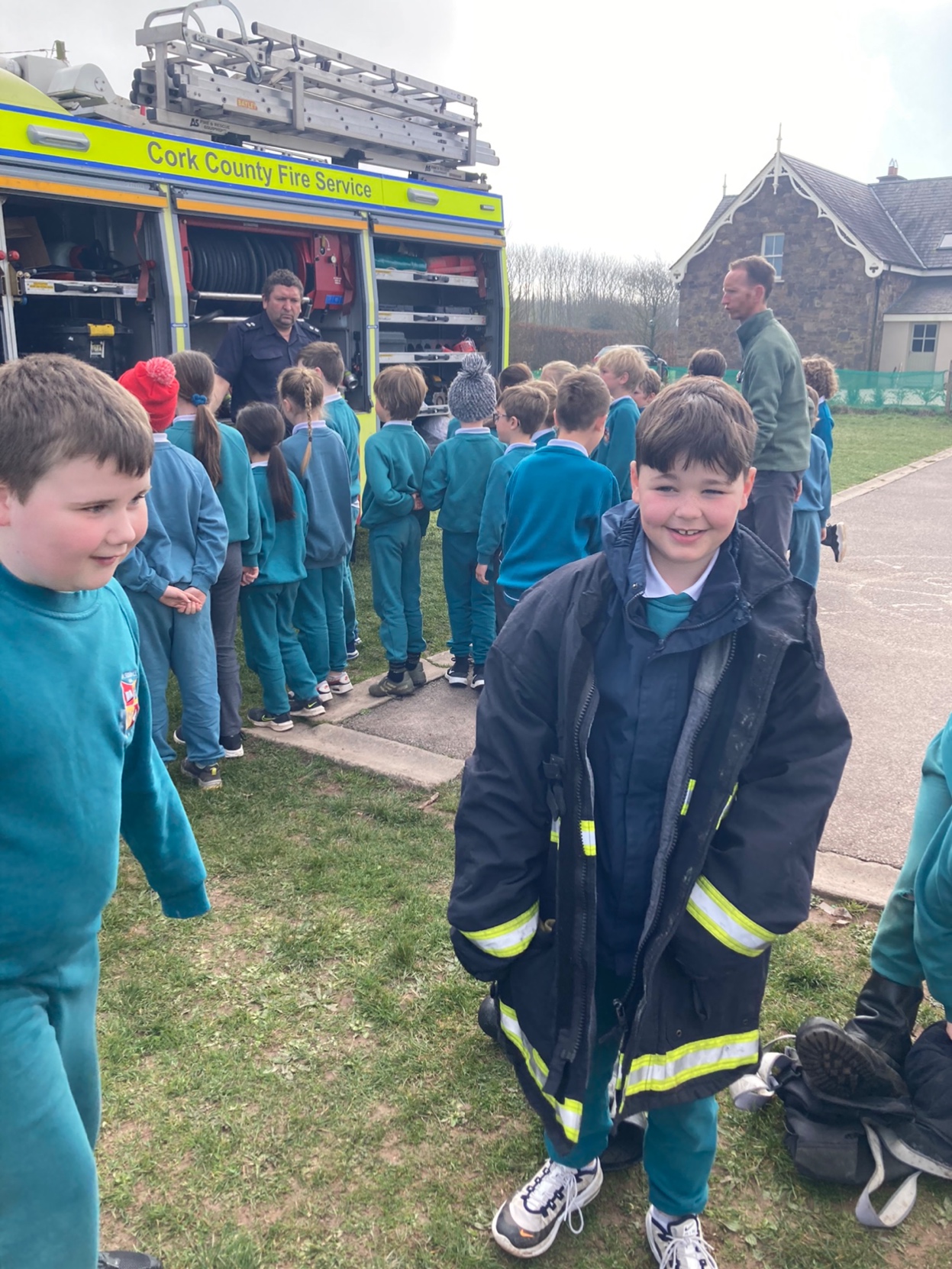 2nd class trying on the fire-fighter's jacket!